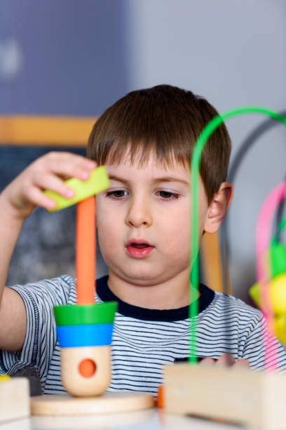 istock Smart child plays with didactic toys 874066752