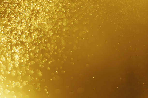 istock Glitter light abstract gold bokeh christmas blurred background 874067056