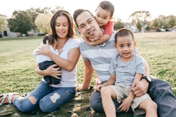 istock Family with three kids having fun 874070616