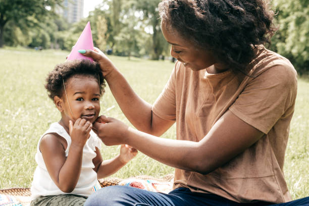 istock Playing outside the house with mom and dolls 874070728