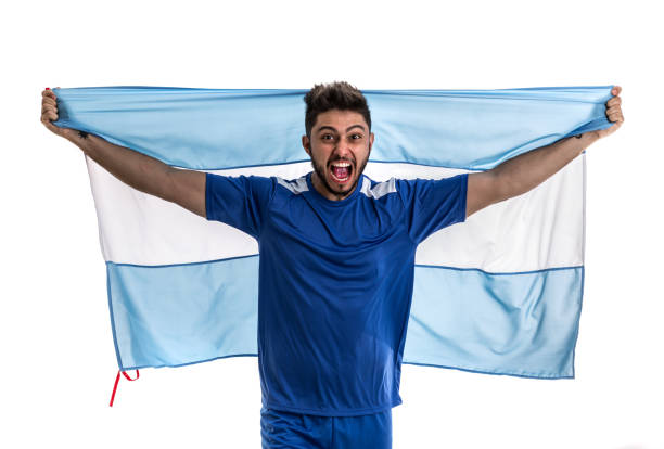 istock Argentinian athlete / fan celebrating on white background 874070878