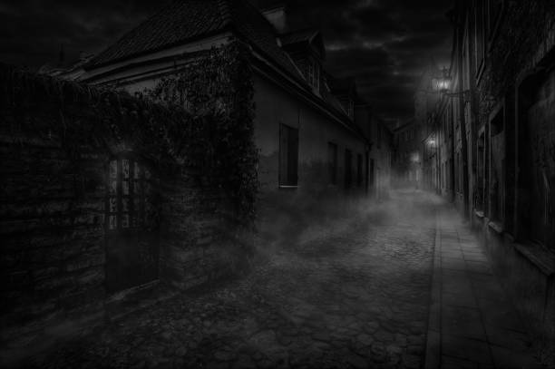 Illuminated by wall lamps, a foggy alley is sleeping