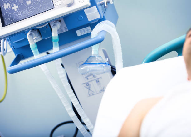 istock Man in ICU under the life support 874071870