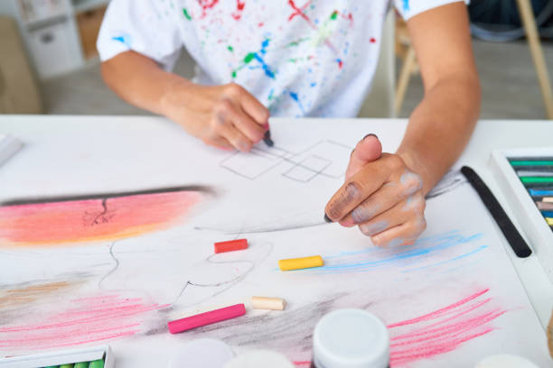 istock Young Woman Painting with Pastels 874083964