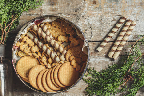 sweet cookies different grades in a container on a wooden surface