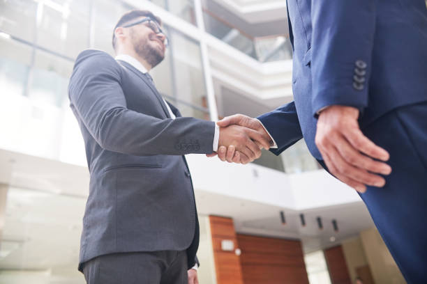 istock Firm Handshake of Business Partners 874088244