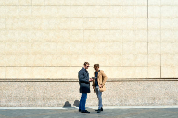 istock Background of Two Men in City 874088550