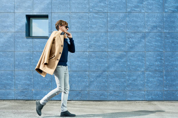 istock Modern young Man Speaking by Phone in City 874088594