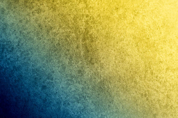 istock A textured vintage stucco background with a dark blue to golden yellow gradient 874091880