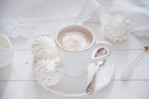 istock Coffee and marshmallow on a white wooden background 874099430
