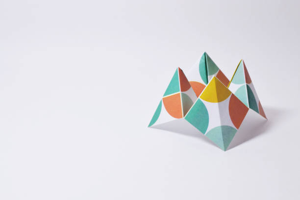 istock colorful origami fortune teller on white background 874099802