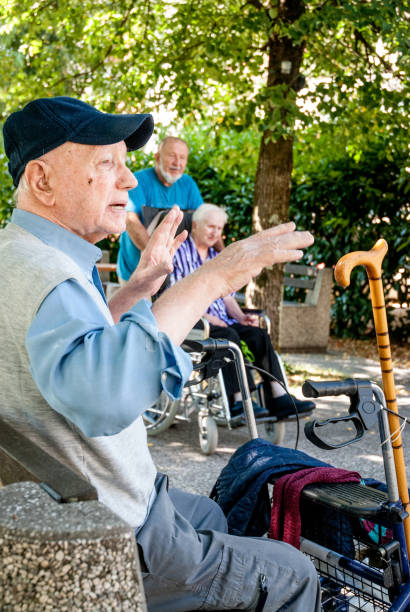 istock Senior Adults Relaxing Outdoors in a Park 874102048