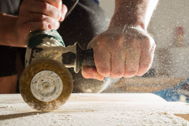 istock Method of artificial aging of wood. Drill with a wire brush. 874102496