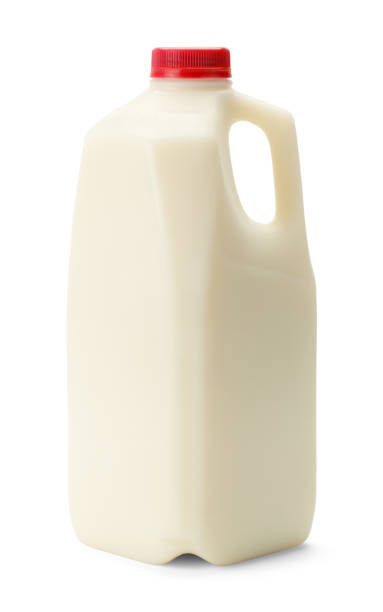 Half Gallon Milk Bottle with Red Cap Isolated on White Background. milk jug stock pictures, royalty-free photos & images