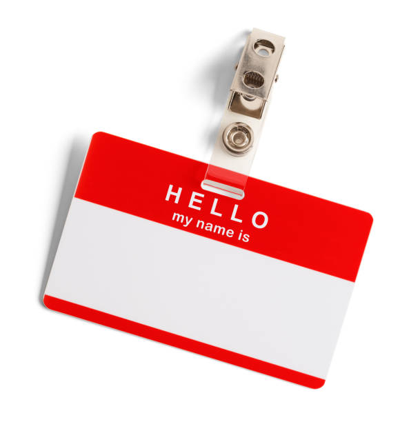 Hello My Name Is Red and White Plastic Name Tag with Hello My Name Is Isolated on White Background. name tag stock pictures, royalty-free photos & images