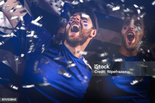 Greek Friends Celebrating On White Background Stock Photo - Download Image Now - Soccer, Fan - Enthusiast, Winning