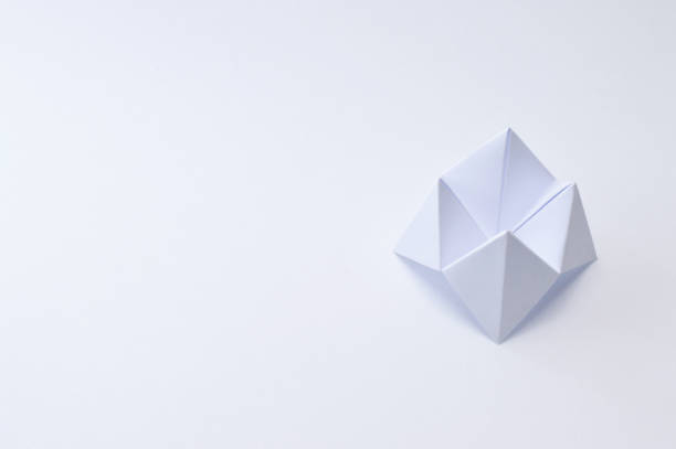 Background with abstract geometric shapes made with folded and illuminated paper