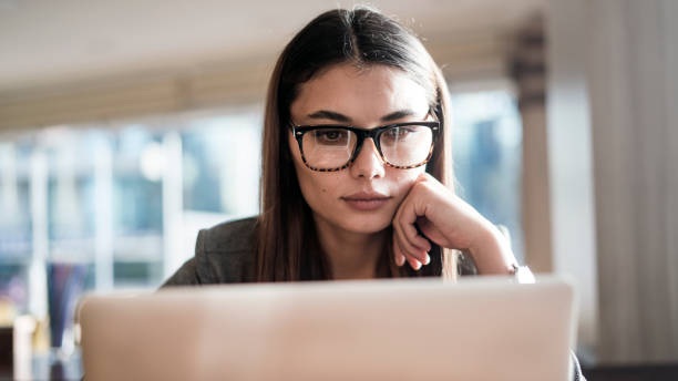 istock Businesswoman working in computer in office 874106420