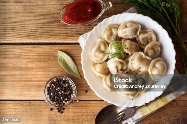 Russian Meat Dumplings Pelmeni With Dill On Wooden Rustic Background Stock Photo - Download Image Now