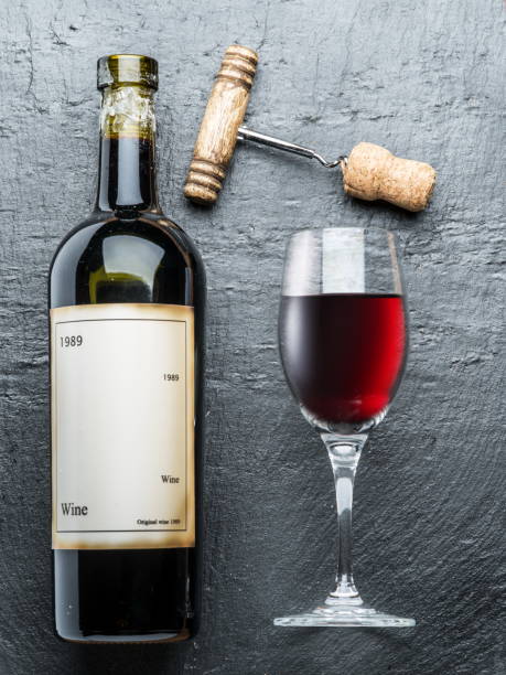 istock Wine bottle, wine glass and corkscrew. 874111124