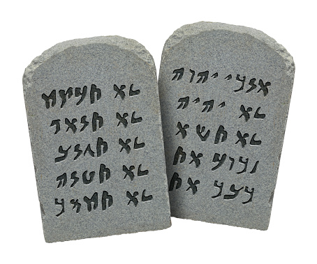 Two Stones with Ten Commandments in Ancient Hebrew Isolated on White Background.