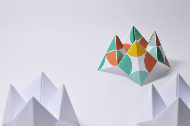 istock three origami fortune tellers on white background 874111534