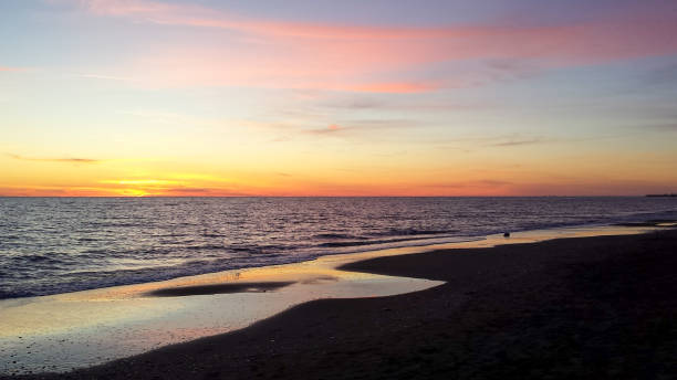 istock Pink sunset on calm sea, Ostia, Rome 874113152