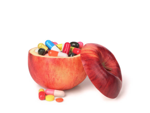 istock Apple fruit full of colorful medicines 874114988