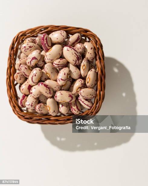 Phaseolus Vulgaris Is Scientific Name Of Sugar Bean Legume Also Known As Feijao Rajado Or Frijol Canaval Wicker Basket With Grains Top View Hard Light Stock Photo - Download Image Now