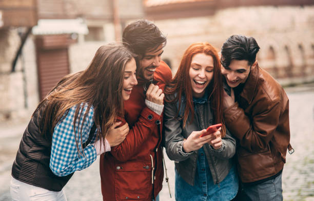 istock Friends texting in the city 874121898
