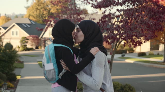4K UHD: Mother and Daughter of Middle Eastern Descent  Embracing