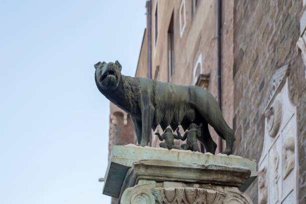 istock Statue of the she-wolf with Rem and Romulu 874125600
