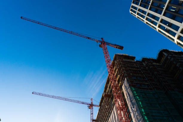 istock Modern glass skycrapers background with sky and clouds reflection. Constraction. 874126100