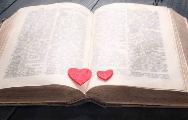 istock Antique book and two hearts on it 874128826