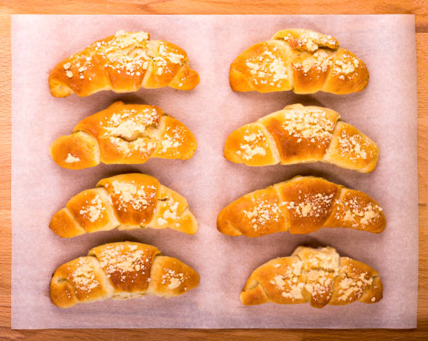 istock Sweet bagels cool down on a sheet of parchment 874129312