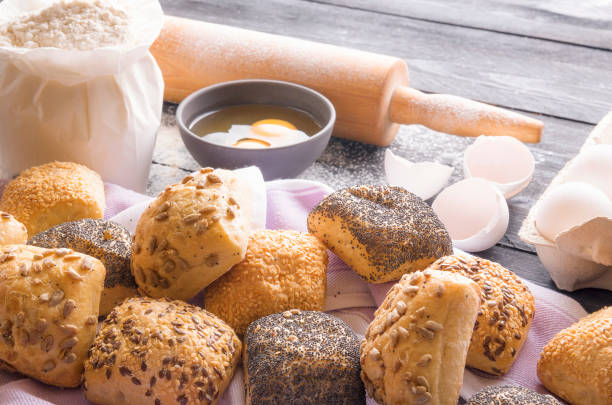 istock Freshly baked bread rolls and ingredients 874129330