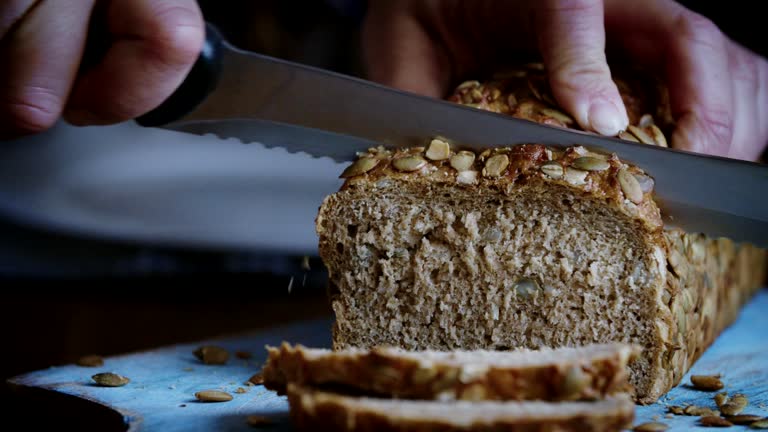 Cutting Fresh Homemade Brown Bread