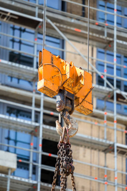 istock Steel lifting crane hook and chain 874132084