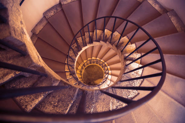 istock Old spiral staircase with metal guardrail 874132606