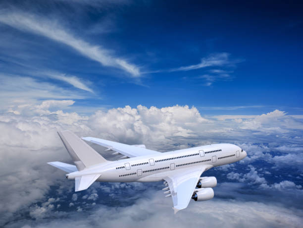 istock Commercial airplane flying above clouds 874132912