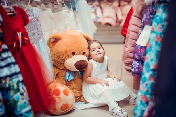 istock Little girl in the store 874135422