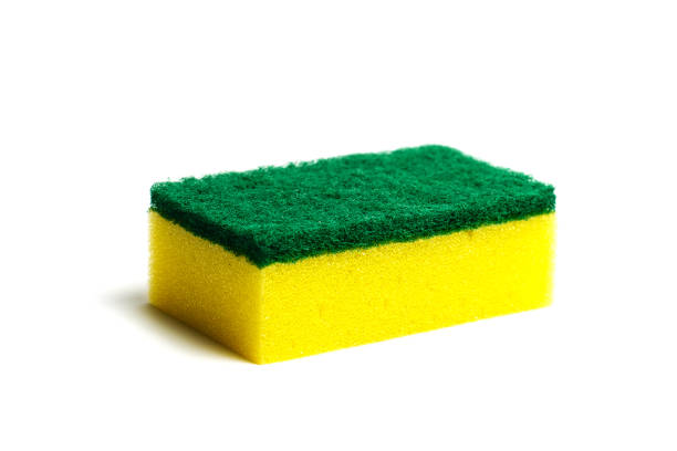 A kitchen sponge isolated on the white background A kitchen sponge isolated on the white background cleaning sponge photos stock pictures, royalty-free photos & images
