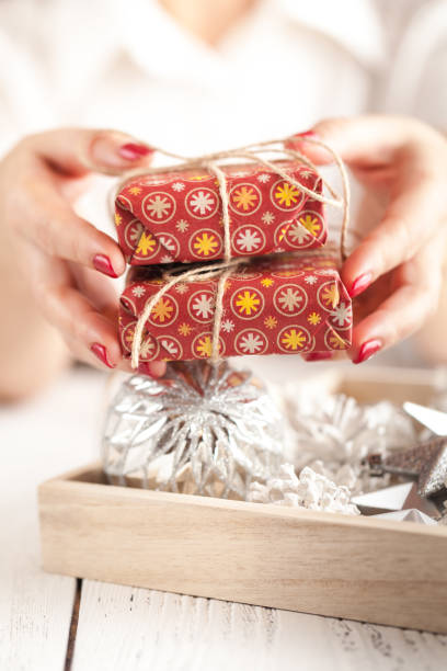 istock Gift box and Christmas decorations on wooden background 874143468