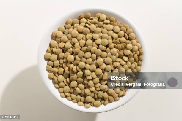 Lens Culinaris Is Scientific Name Of Lentil Legume Also Known As Lentilha Canadense Top View Of Grains In A Bowl White Background Stock Photo - Download Image Now