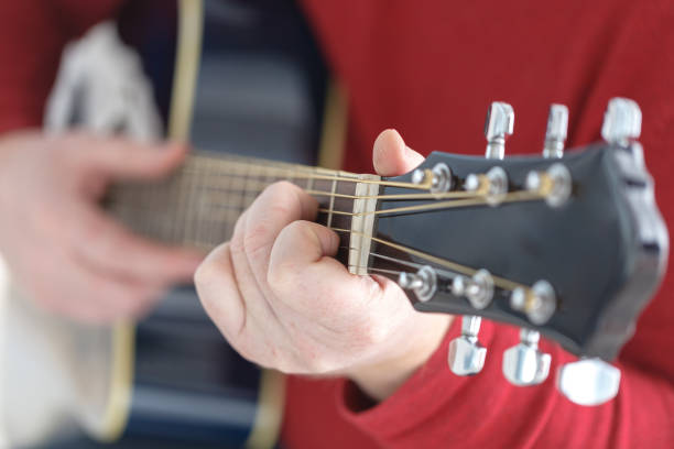 istock hand playing folk guitar action design 874157048