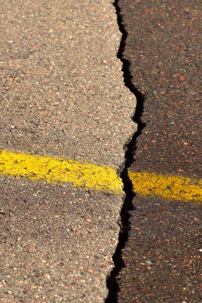 istock Crack in the Road (Winter) Abstract 874161038