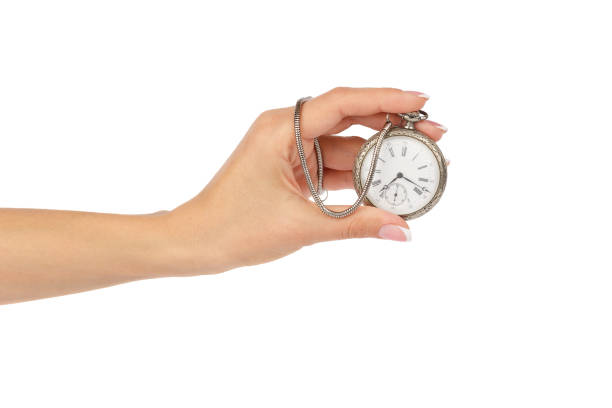 istock Pocket's clock in the woman's hand, isolated 874164036