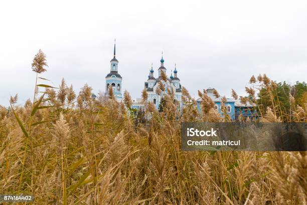 Orthodox Church Behind A Wall Of Dry Cane Stock Photo - Download Image Now - Autumn, Backgrounds, Cattail