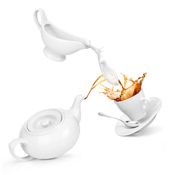 istock Tea and milk are poured into a cup 874165072