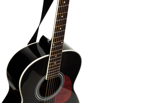 istock Black acoustic guitar on a white background 874165508
